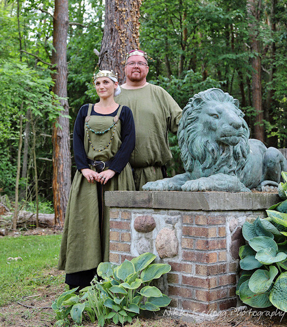 Baron Andiur and Baroness Nuzha in green with lion
